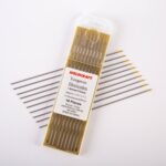 Close-up of a 10-pack of Weldcraft 1.6mm (1/16 inch) gold pure tungsten electrodes for TIG welding, ground finish, on a gold background.