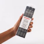 Hand holding of Weldcraft 2.4mm (3/32 inch) black 1.0% lanthanated tungsten electrodes (WL10) for TIG welding