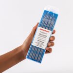 Hand holding Of Ten Weldcraft 2.4mm (3/32 inch) Sky-blue 2% Lanthanated Tungsten Electrodes For TIG Welding