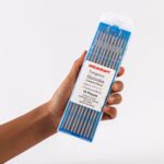 Hand holding Of Ten Weldcraft 3.2mm (1/8 inch) Sky-blue 2% Lanthanated Tungsten Electrodes For TIG Welding