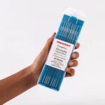 Hand holding Of Ten Weldcraft 1.6mm (1/16 inch) Sky-blue 2% Lanthanated Tungsten Electrodes For TIG Welding