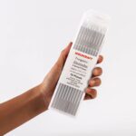 Hand holding of ten Weldcraft 2.4mm (3/32 inch) white (WZ8) 0.8% zirconiated tungsten electrodes TIG welding