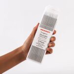 Hand holding of ten Weldcraft 3.2mm (1/8 inch) white (WZ8) 0.8% zirconiated tungsten electrodes TIG welding