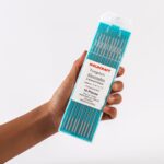 Hand holding of Weldcraft 2.4mm (3/32 inch) emerald (Composite) WS2 tungsten electrodes for TIG welding